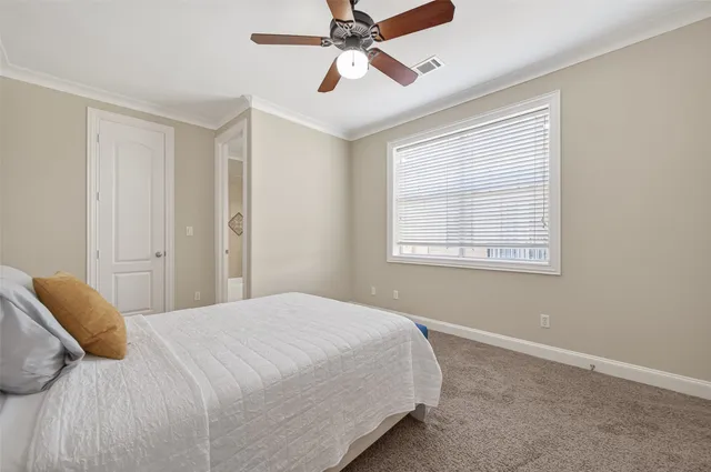 a bathroom with a granite countertop sink a mirror and a shower