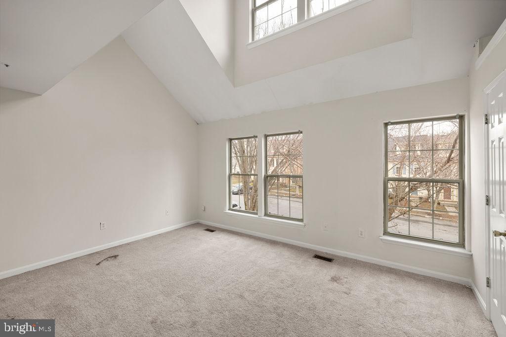 9823 Sherwood Farm Road Owings Mills, MD 21117 - Photo 11 of 29 an empty room with windows
