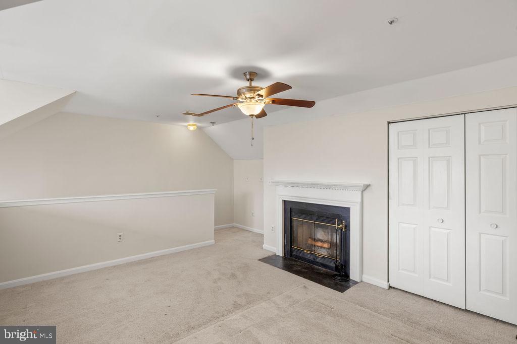 9823 Sherwood Farm Road Owings Mills, MD 21117 - Photo 17 of 29 a view of an empty room with a fireplace