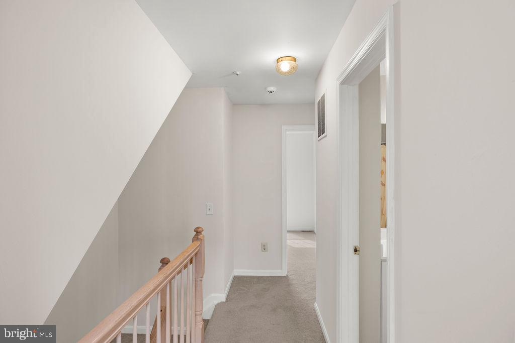 9823 Sherwood Farm Road Owings Mills, MD 21117 - Photo 18 of 29 a view of a hallway