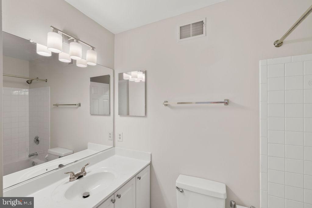9823 Sherwood Farm Road Owings Mills, MD 21117 - Photo 19 of 29 a bathroom with a sink a toilet and shower