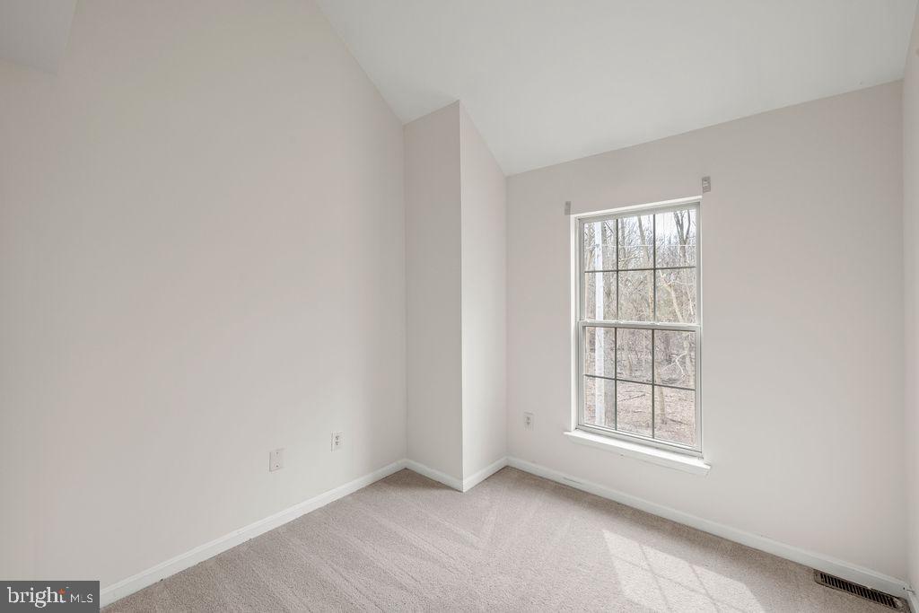9823 Sherwood Farm Road Owings Mills, MD 21117 - Photo 23 of 29 an empty room with windows