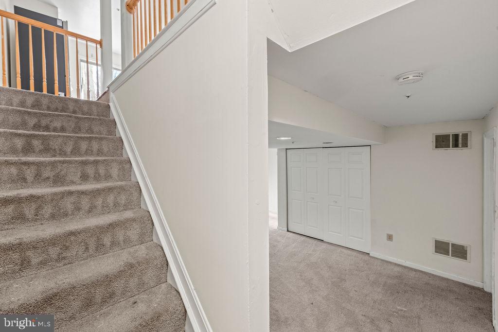 9823 Sherwood Farm Road Owings Mills, MD 21117 - Photo 25 of 29 a view of staircase with railing and white walls