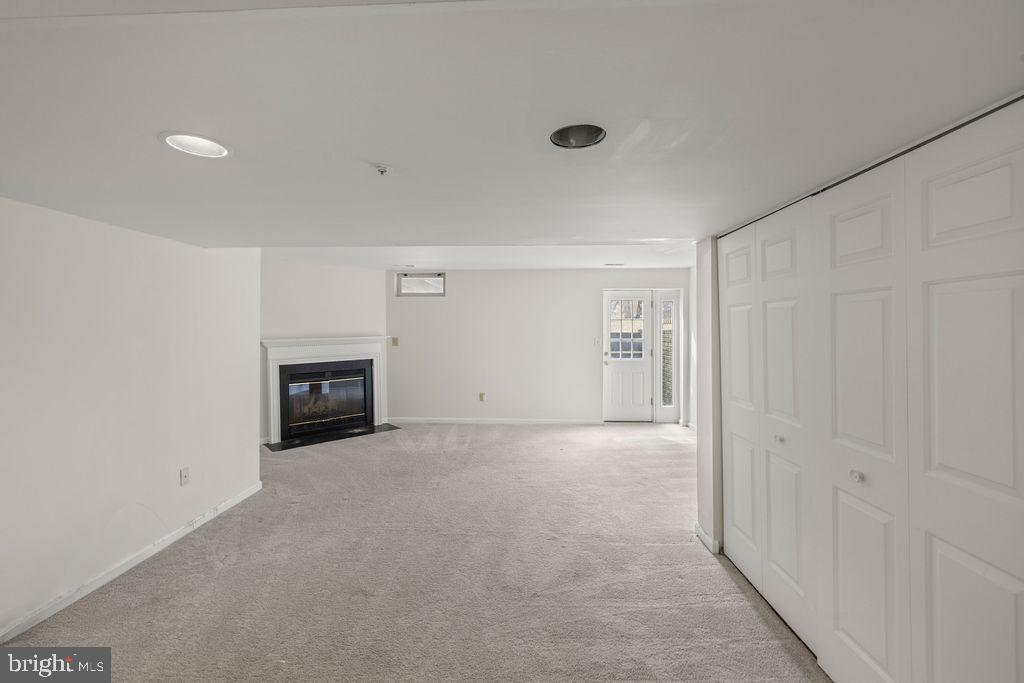 9823 Sherwood Farm Road Owings Mills, MD 21117 - Photo 26 of 29 a view of an empty room with a fireplace