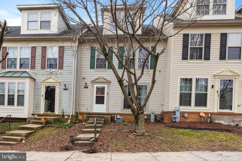 9823 Sherwood Farm Road Owings Mills, MD 21117 - Photo 3 of 29 a front view of a house with a yard