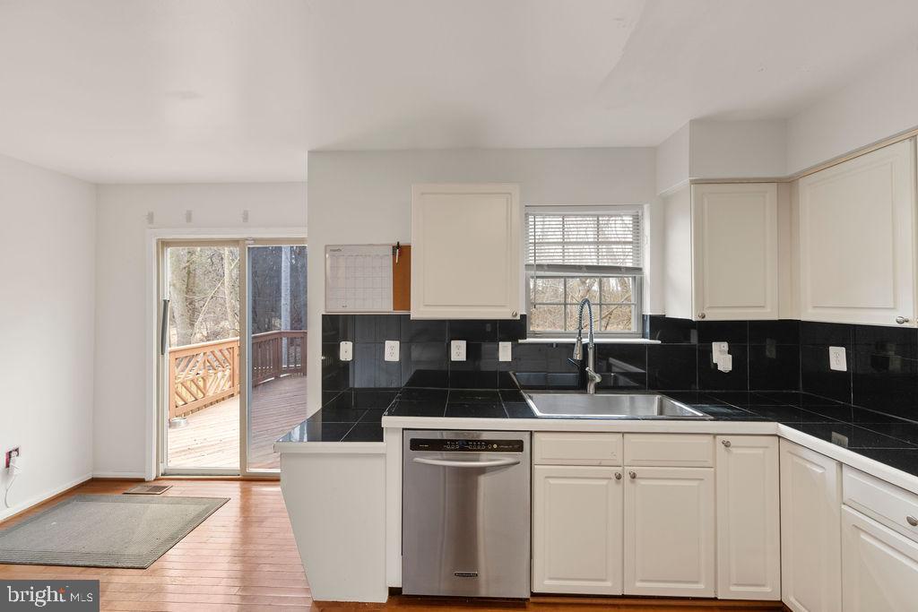 9823 Sherwood Farm Road Owings Mills, MD 21117 - Photo 7 of 29 a kitchen with a sink and cabinets