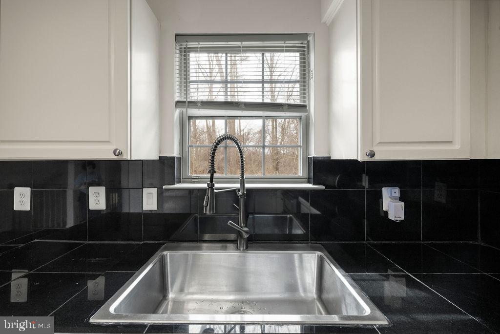 9823 Sherwood Farm Road Owings Mills, MD 21117 - Photo 8 of 29 a kitchen with sink and window