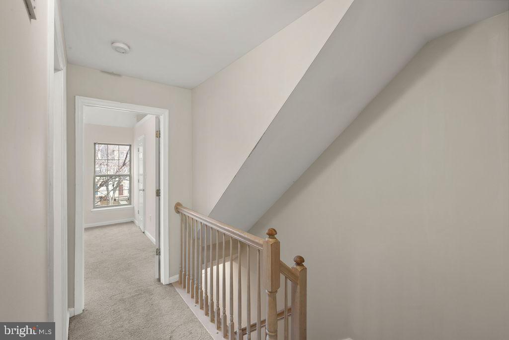 9823 Sherwood Farm Road Owings Mills, MD 21117 - Photo 10 of 29 a view of a hallway with windows