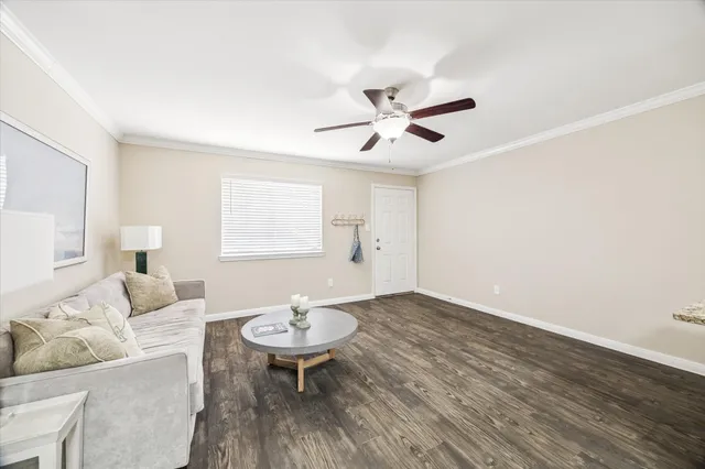 a view of a livingroom with furniture and wooden floor