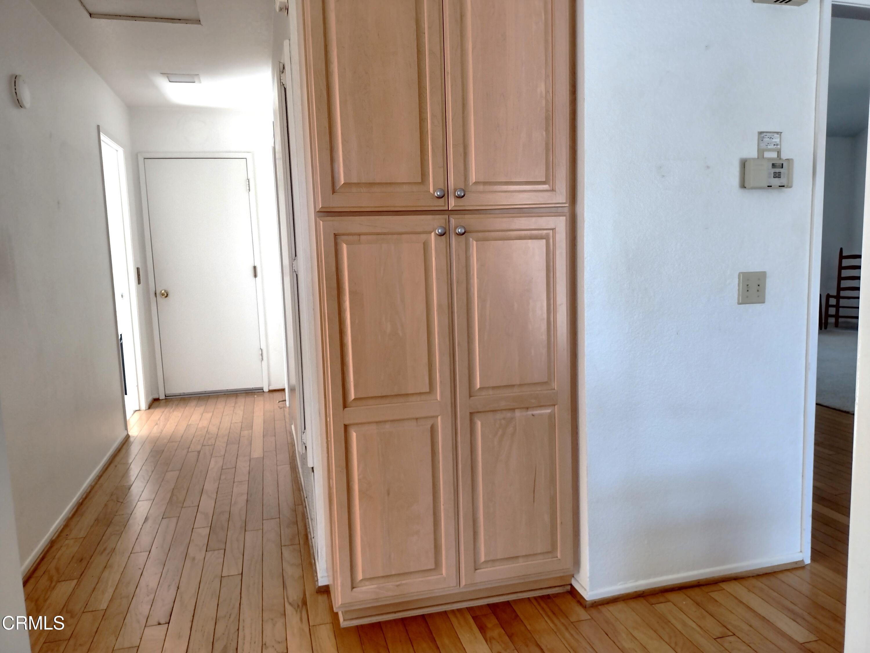 5928 Palomar Circle Camarillo, CA 93012 - Photo 11 of 33 a view of a hallway with wooden floor