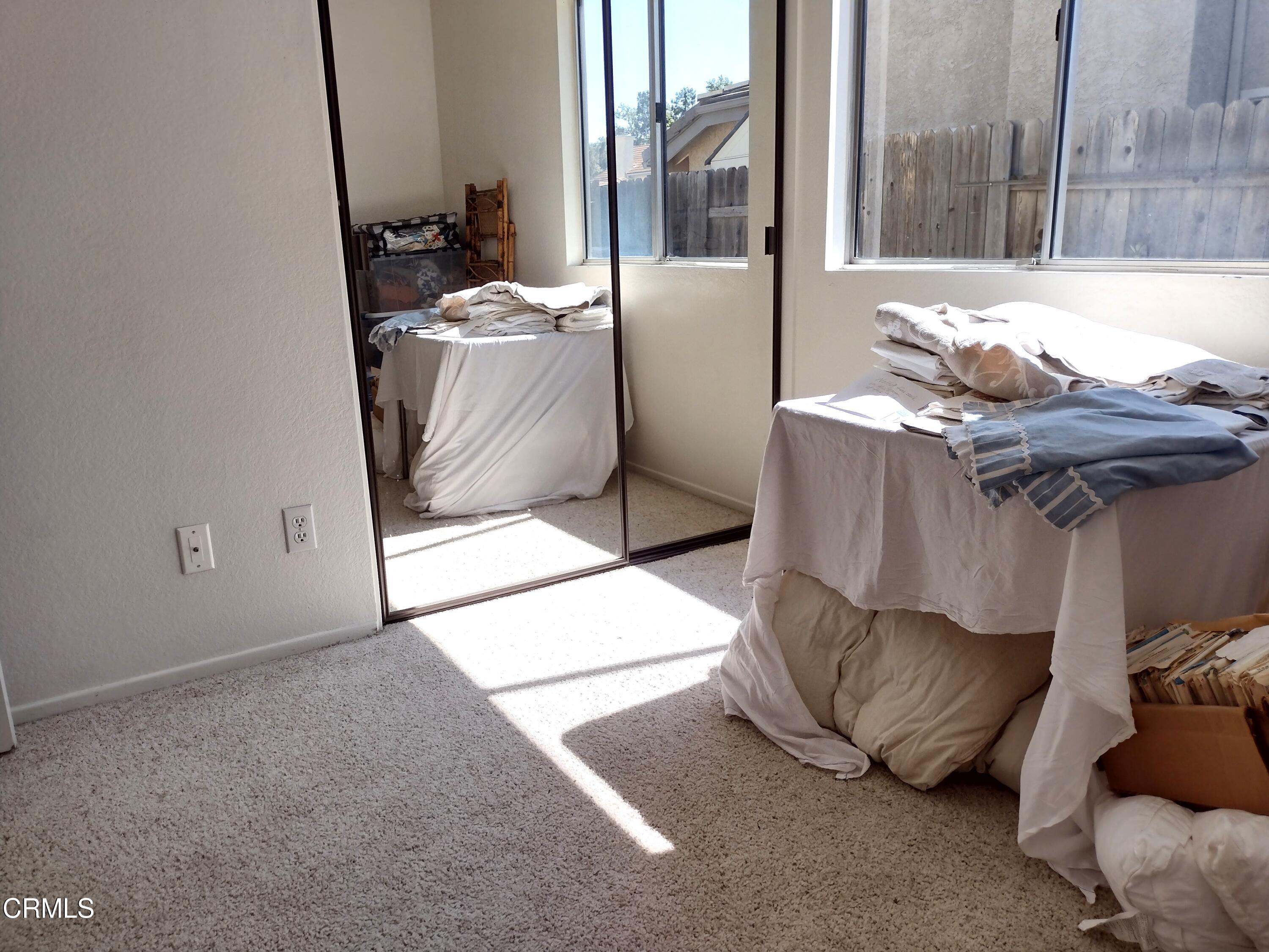 5928 Palomar Circle Camarillo, CA 93012 - Photo 21 of 33 a living room with furniture and a floor to ceiling window