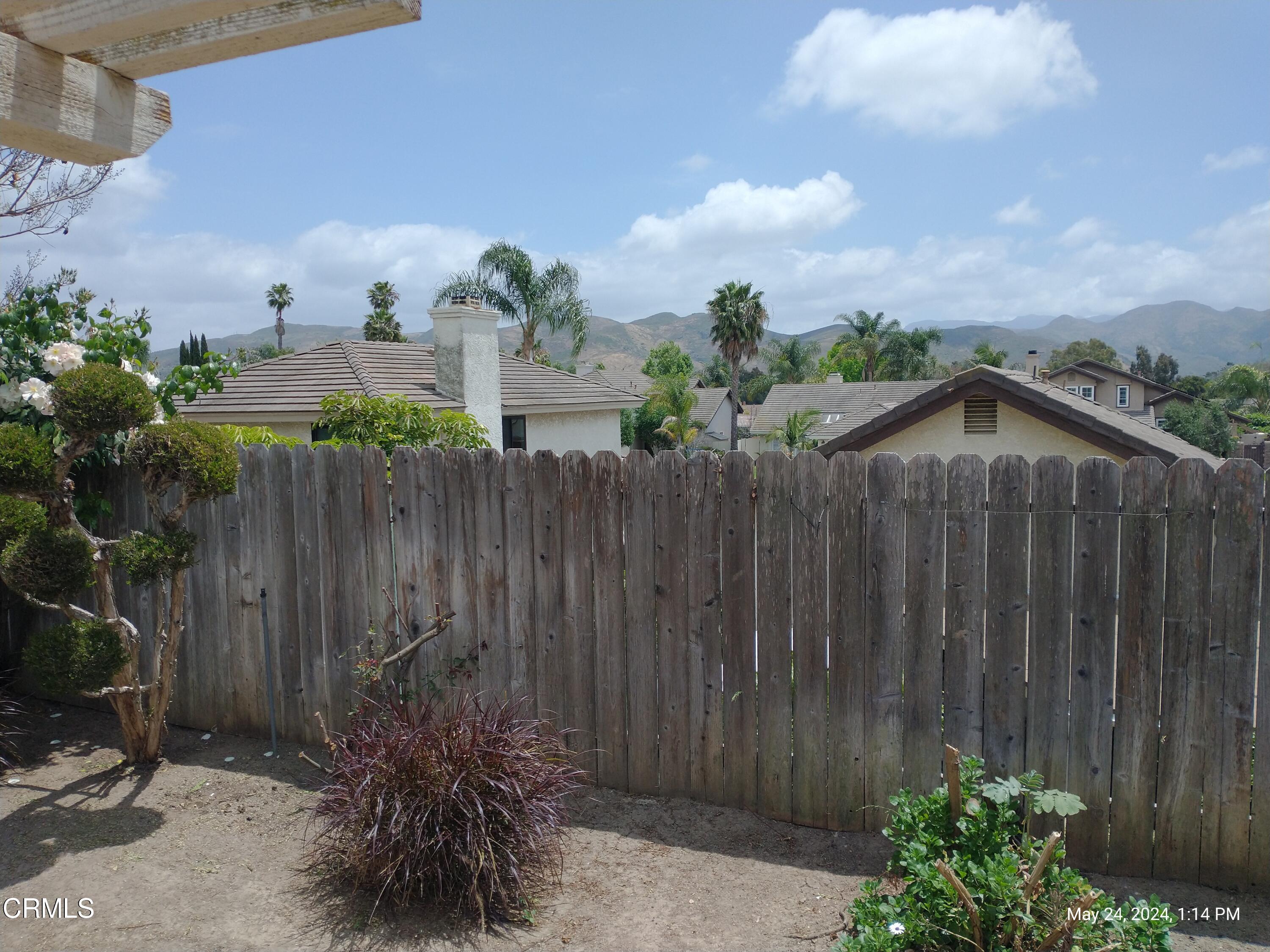 5928 Palomar Circle Camarillo, CA 93012 - Photo 30 of 33 a view of a backyard with plants and wooden fence