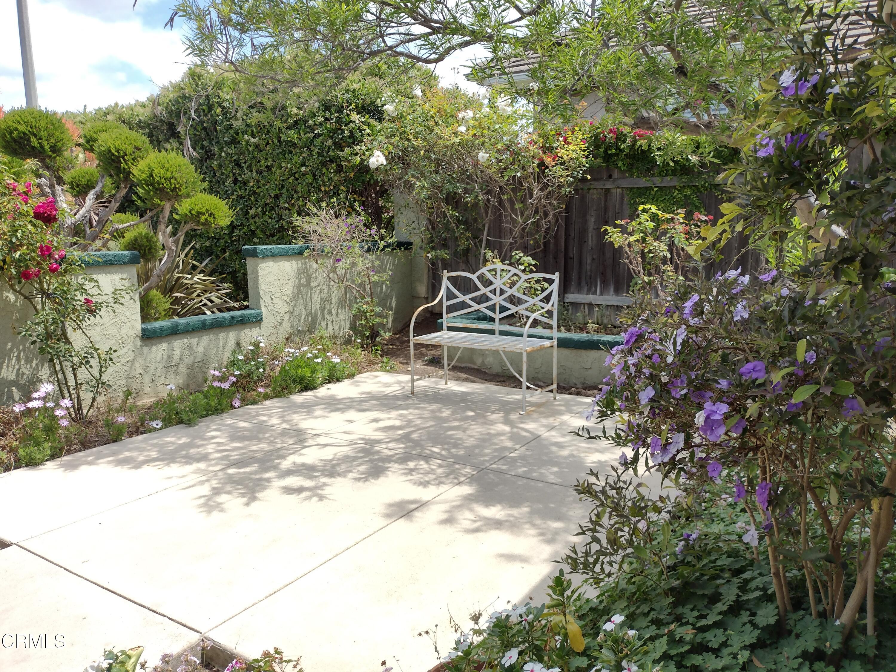 5928 Palomar Circle Camarillo, CA 93012 - Photo 4 of 33 a wooden bench sitting in front of a building