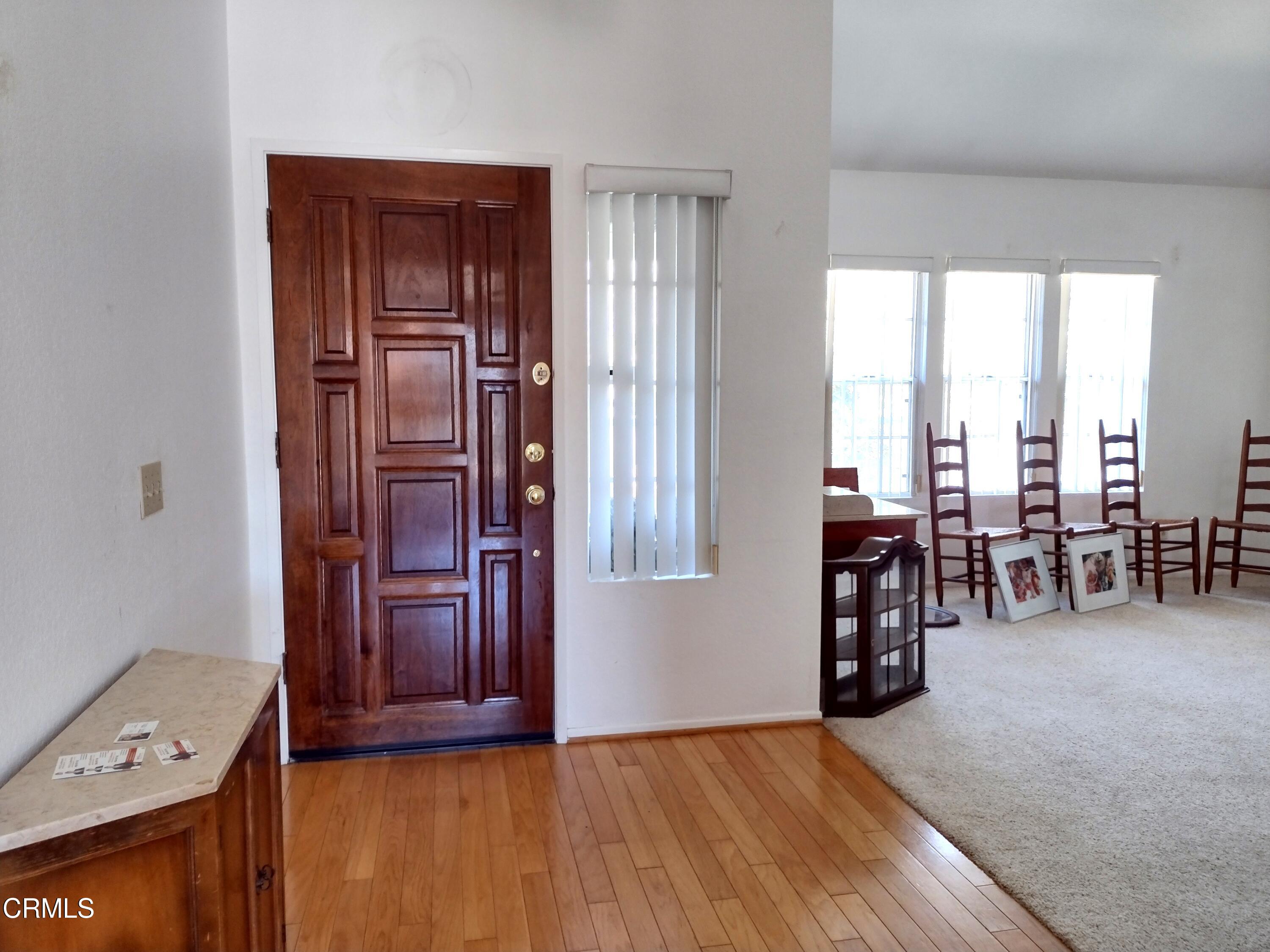 5928 Palomar Circle Camarillo, CA 93012 - Photo 5 of 33 wooden floor in an empty room and a window