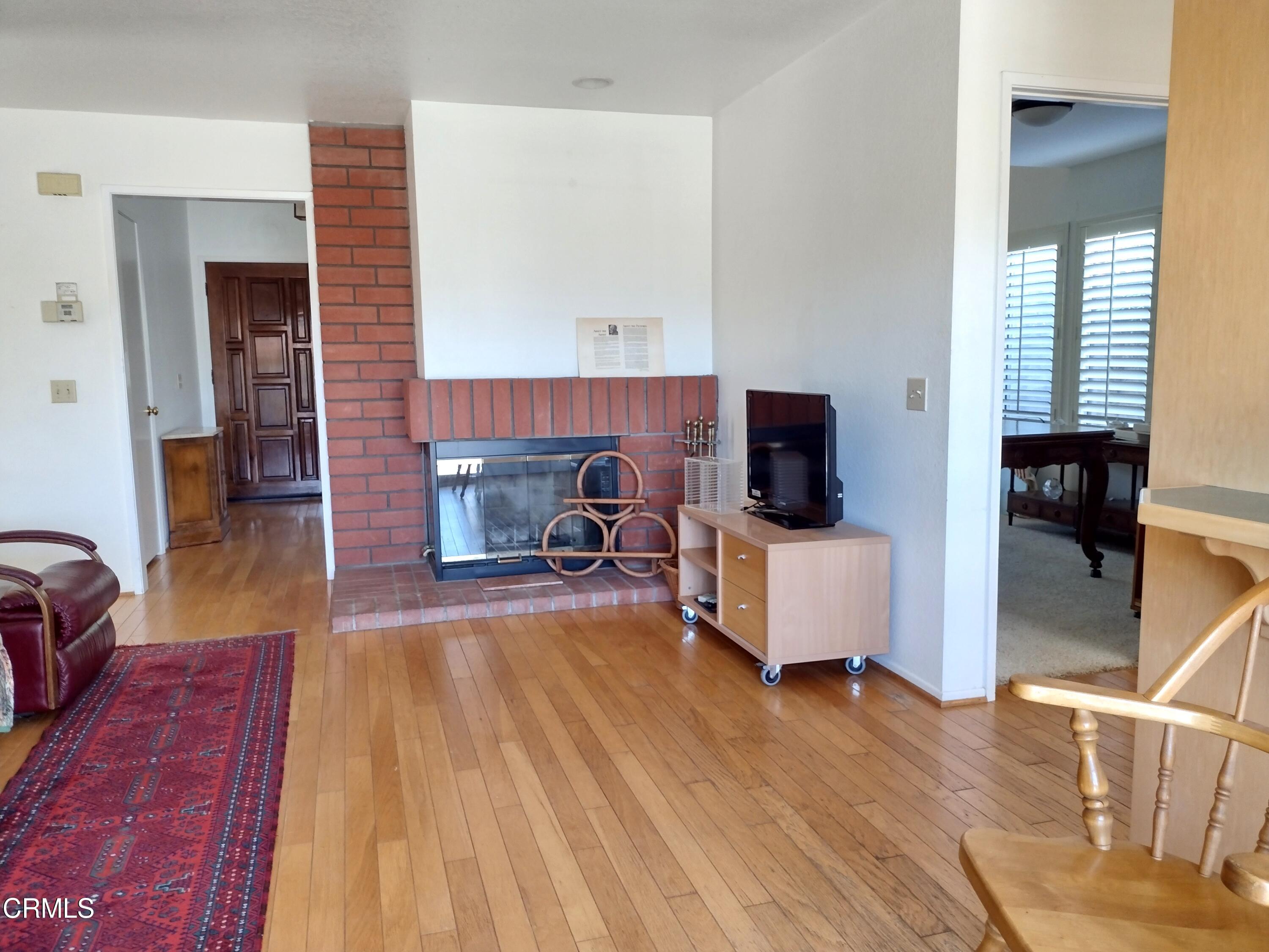 5928 Palomar Circle Camarillo, CA 93012 - Photo 7 of 33 a living room with furniture and a fireplace