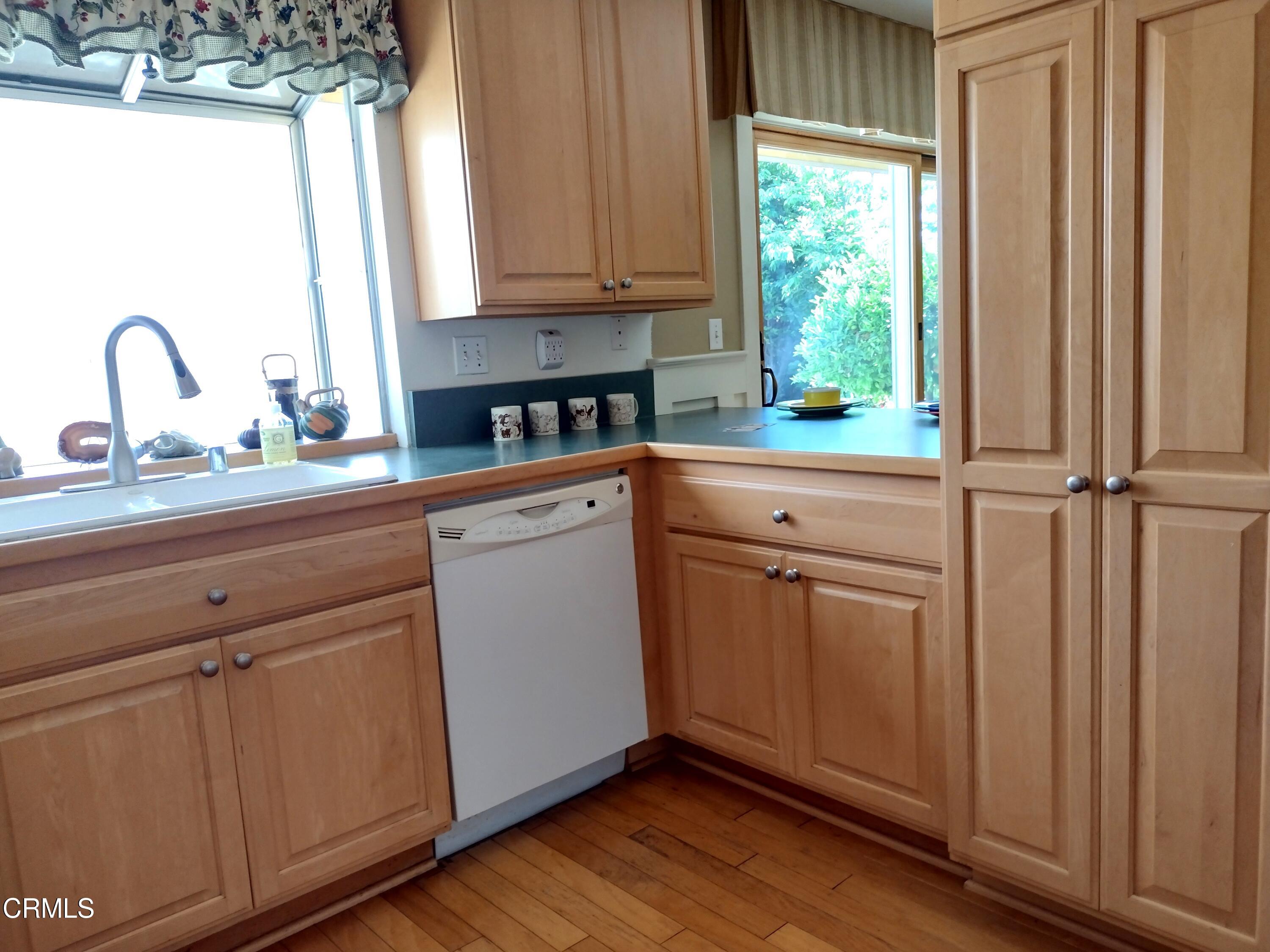 5928 Palomar Circle Camarillo, CA 93012 - Photo 9 of 33 a view of cabinets with wooden floor and window