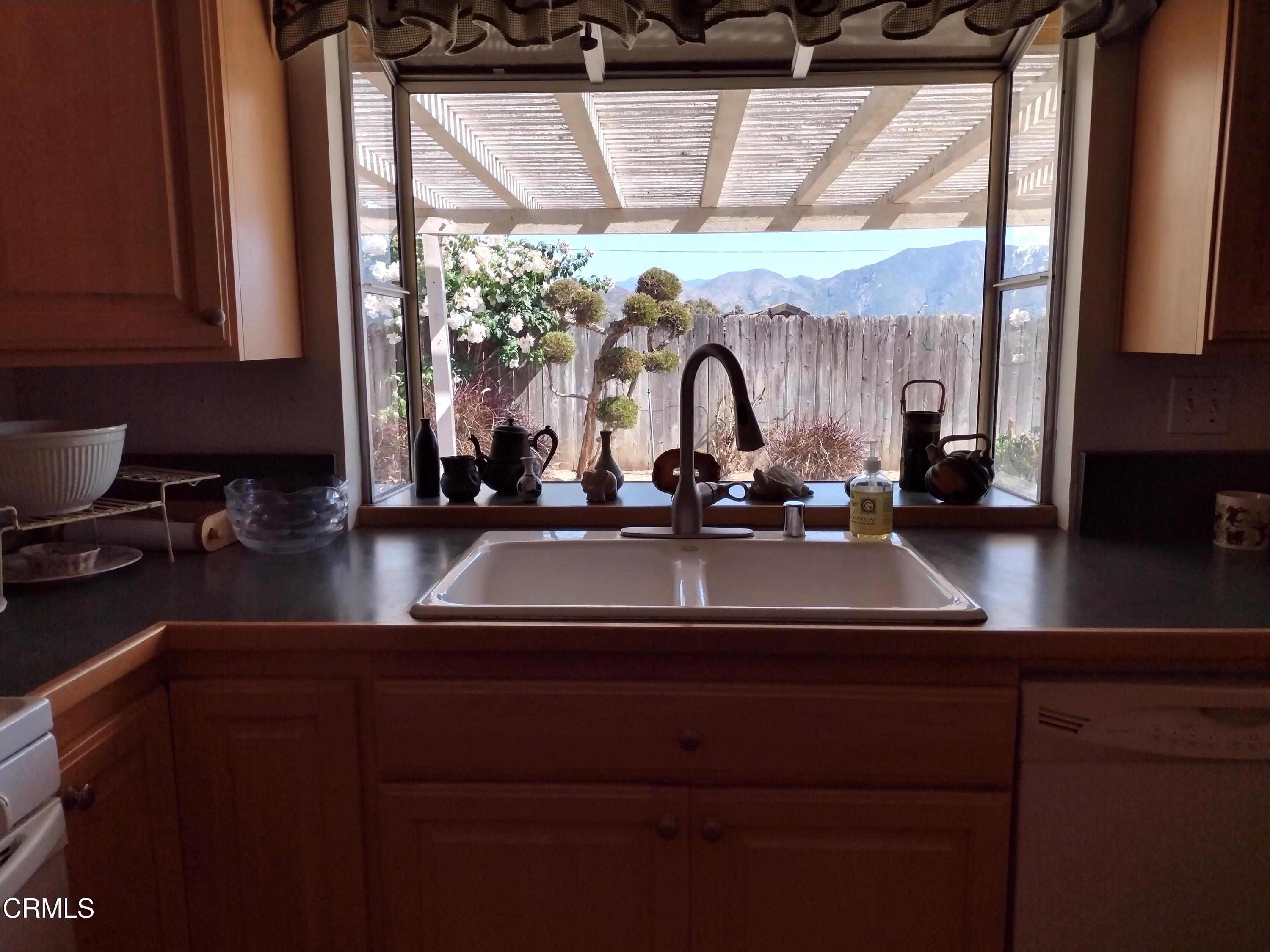 5928 Palomar Circle Camarillo, CA 93012 - Photo 10 of 33 a kitchen with a sink and a large window