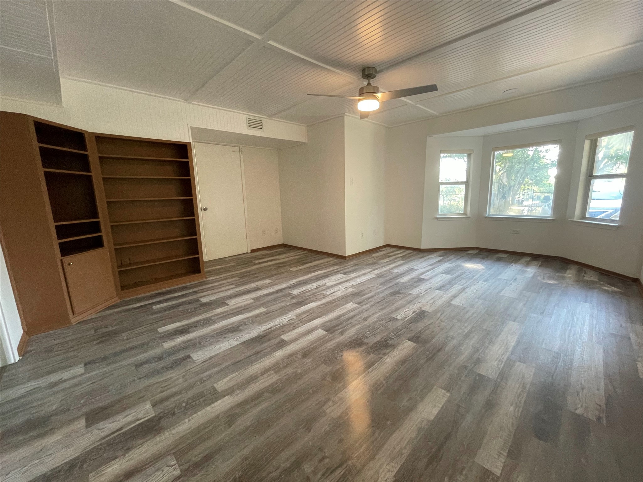 5802 Longhorn Landing Austin, TX 78734 - Photo 24 of 38 Unfurnished bedroom featuring dark wood-style flooring and a ceiling fan