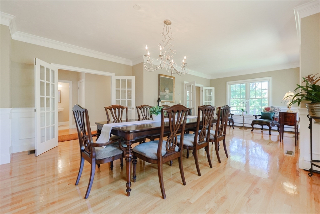 4 Berkeley Drive Walpole, MA 02081 - Photo 11 of 42 a view of a a dining room with furniture window and wooden floor