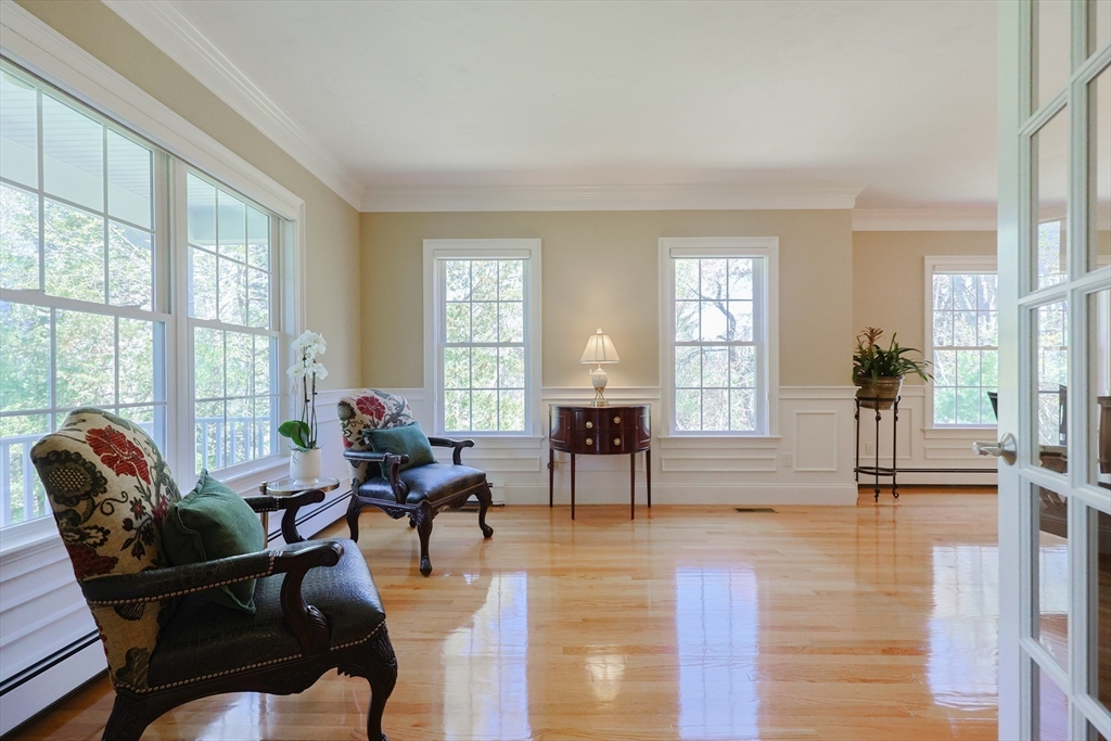 4 Berkeley Drive Walpole, MA 02081 - Photo 12 of 42 a living room with furniture and a large window