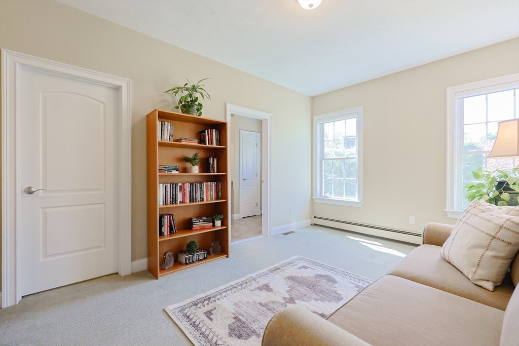 4 Berkeley Drive Walpole, MA 02081 - Photo 14 of 42 a living room with furniture and closet