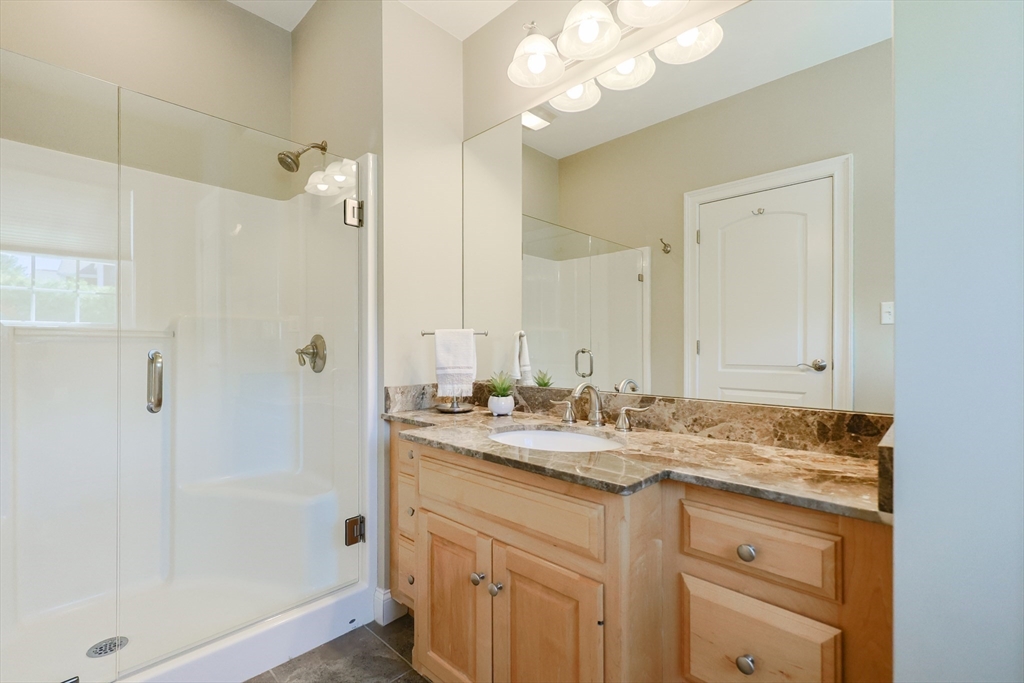 4 Berkeley Drive Walpole, MA 02081 - Photo 16 of 42 a bathroom with a sink vanity granite tub and shower