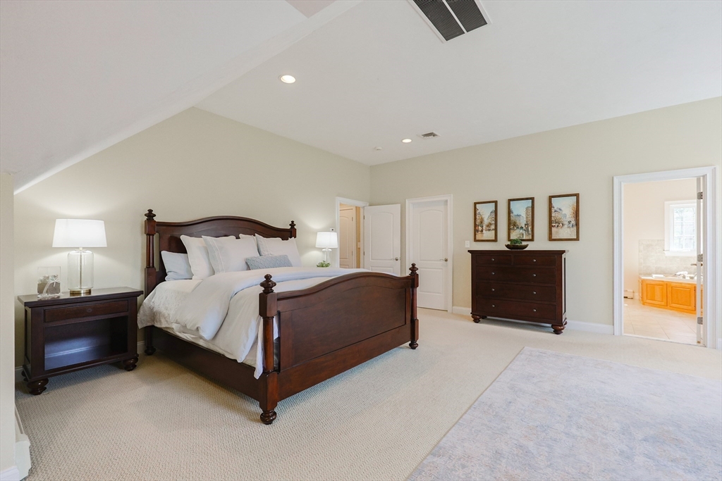 4 Berkeley Drive Walpole, MA 02081 - Photo 19 of 42 a bedroom with a bed and lamp