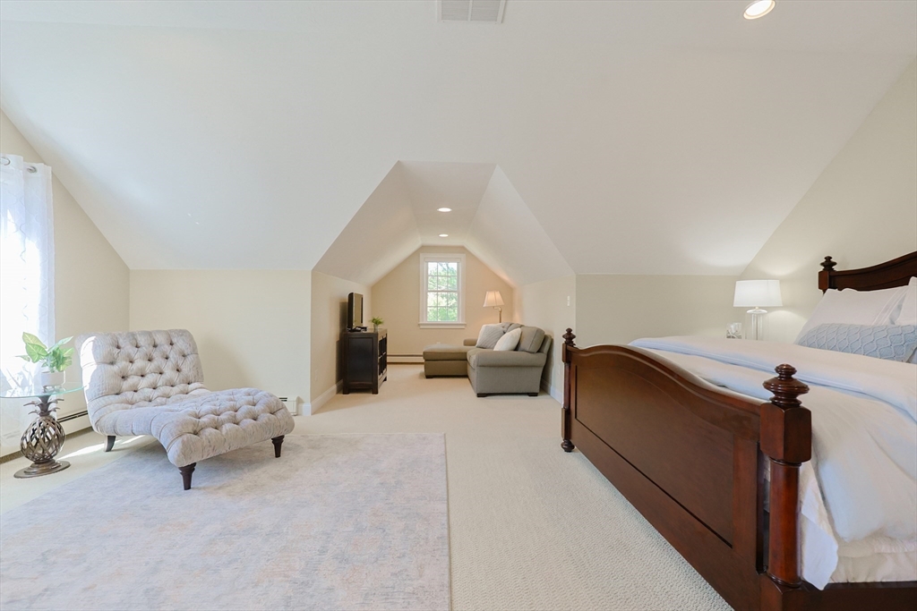 4 Berkeley Drive Walpole, MA 02081 - Photo 20 of 42 a living room with furniture and a lamp