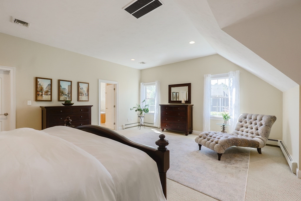 4 Berkeley Drive Walpole, MA 02081 - Photo 22 of 42 a bedroom with a bed and wooden floor