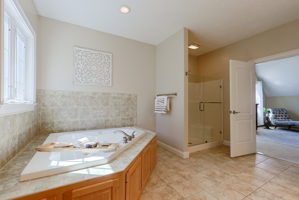 4 Berkeley Drive Walpole, MA 02081 - Photo 26 of 42 a bathroom with a sink and a bathtub