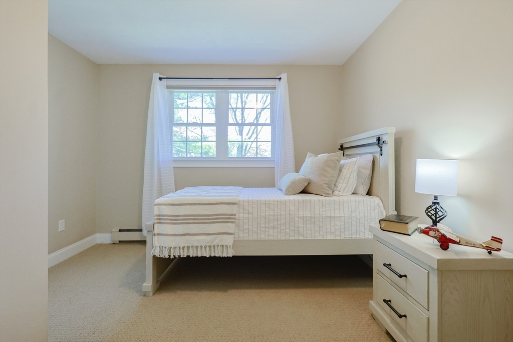 4 Berkeley Drive Walpole, MA 02081 - Photo 28 of 42 a bedroom with a bed and a window