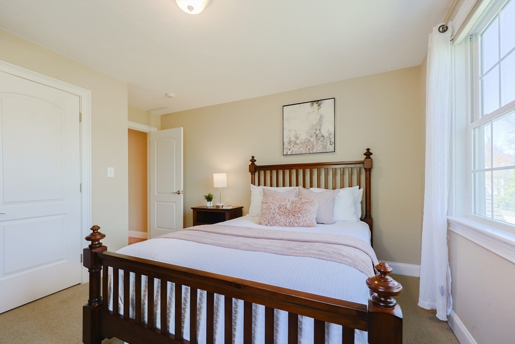 4 Berkeley Drive Walpole, MA 02081 - Photo 31 of 42 a bedroom with a bed and a window