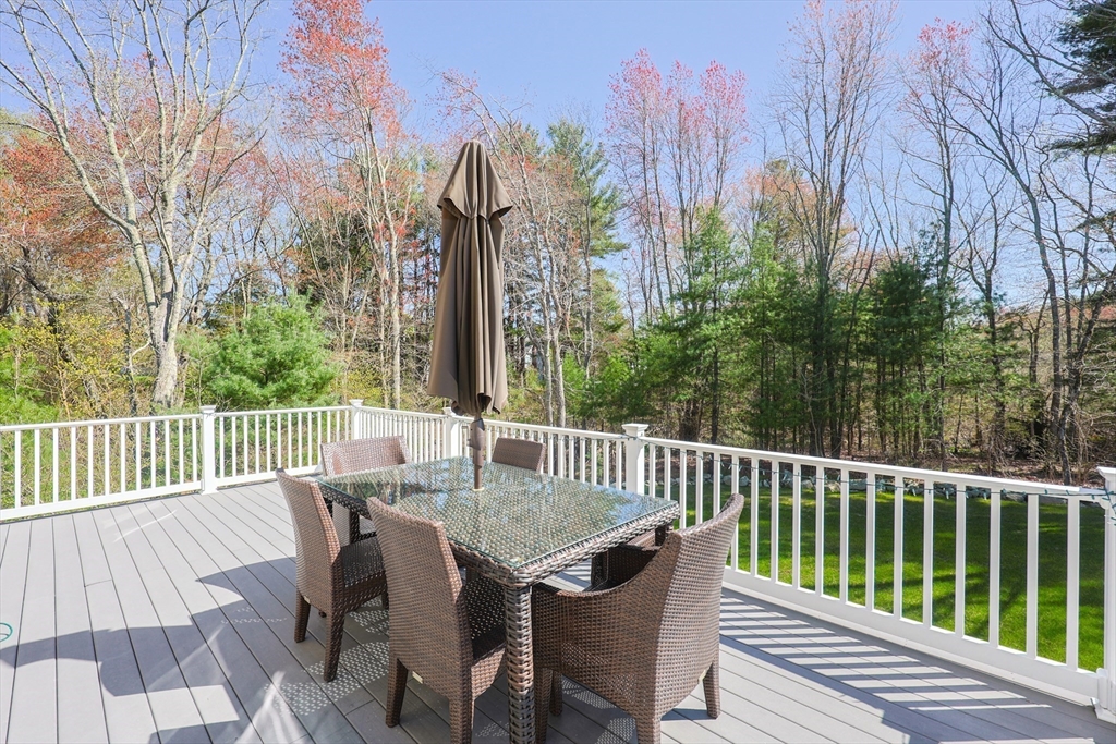 4 Berkeley Drive Walpole, MA 02081 - Photo 38 of 42 a view of a table and chairs on the roof deck