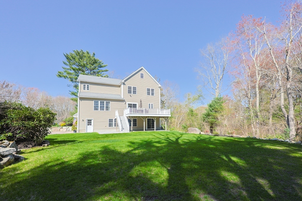 4 Berkeley Drive Walpole, MA 02081 - Photo 39 of 42 a view of a house with a big yard and large trees