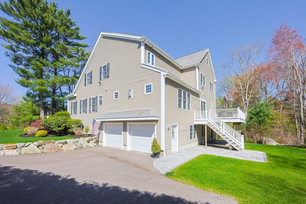 4 Berkeley Drive Walpole, MA 02081 - Photo 40 of 42 a view of house with outdoor space and swimming pool