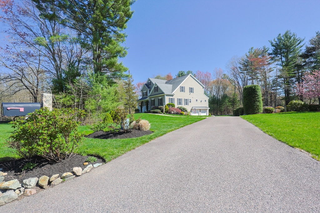 4 Berkeley Drive Walpole, MA 02081 - Photo 41 of 42 a view of a house with a small yard and large trees