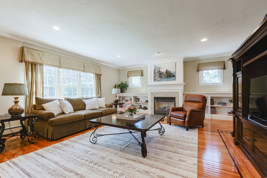 4 Berkeley Drive Walpole, MA 02081 - Photo 8 of 42 a living room with furniture fireplace and window
