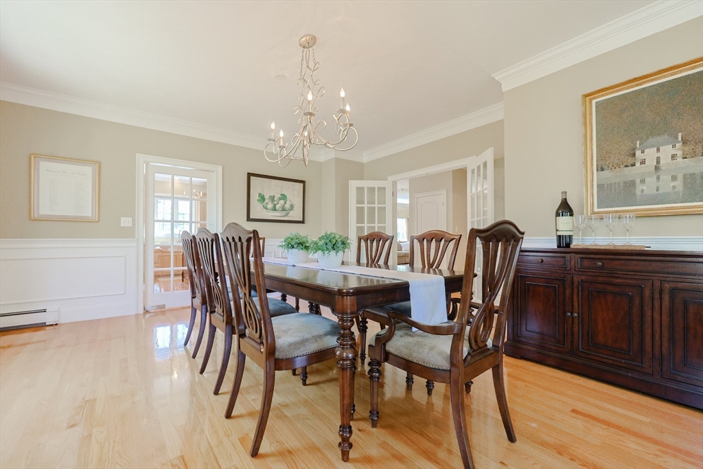 4 Berkeley Drive Walpole, MA 02081 - Photo 10 of 42 a view of a dining room with furniture and chandelier