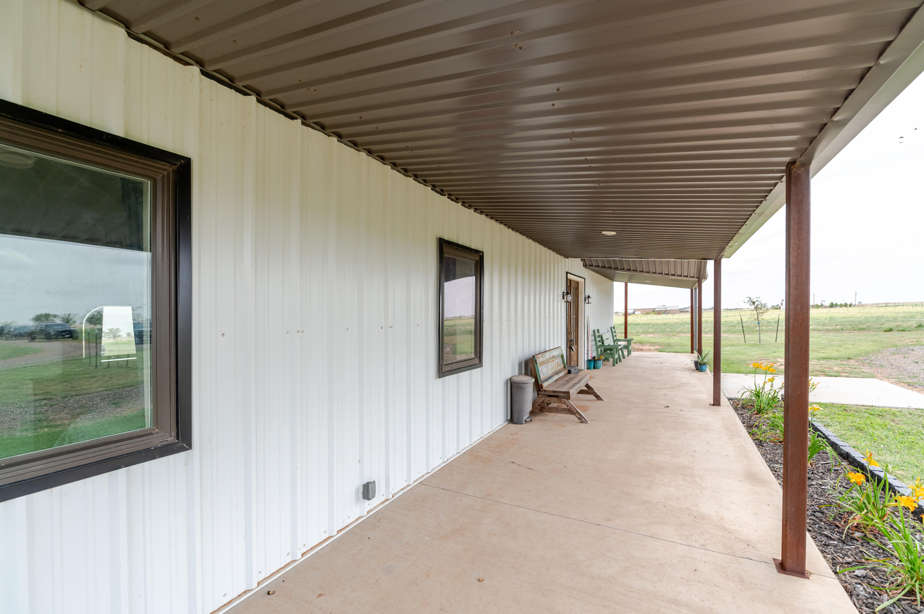 6792 Maine Road Anton, TX 79313 - Photo 66 of 77 a lobby with furniture and floor to ceiling window