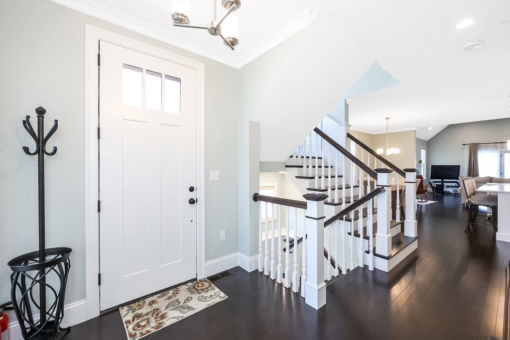 13 Birkdale Lane, Unit 13 Hopkinton, MA 01748 - Photo 14 of 27 a view of entryway and hall with wooden floor