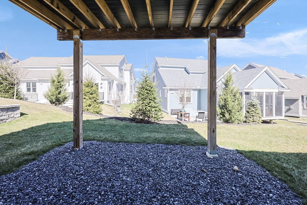 13 Birkdale Lane, Unit 13 Hopkinton, MA 01748 - Photo 23 of 27 a view of a house with backyard and porch