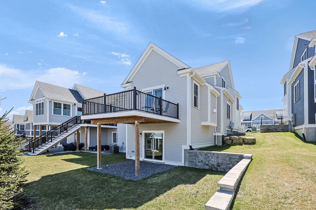 13 Birkdale Lane, Unit 13 Hopkinton, MA 01748 - Photo 25 of 27 a view of a house with a yard balcony