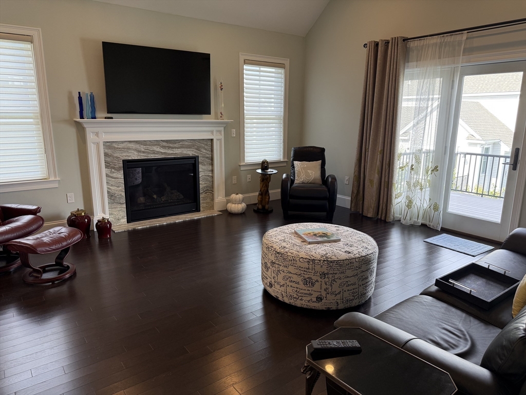 13 Birkdale Lane, Unit 13 Hopkinton, MA 01748 - Photo 4 of 27 a living room with furniture or fireplace and a flat screen tv