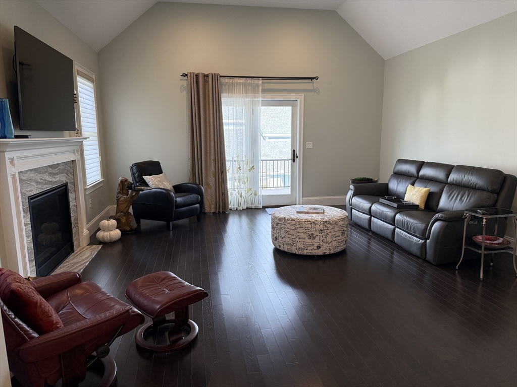 13 Birkdale Lane, Unit 13 Hopkinton, MA 01748 - Photo 5 of 27 a living room with furniture fireplace and flat screen tv