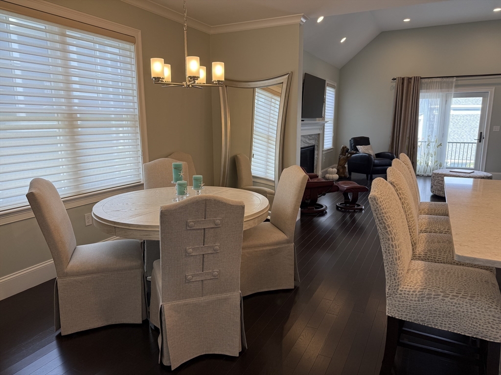 13 Birkdale Lane, Unit 13 Hopkinton, MA 01748 - Photo 6 of 27 a view of a dining room with furniture and wooden floor