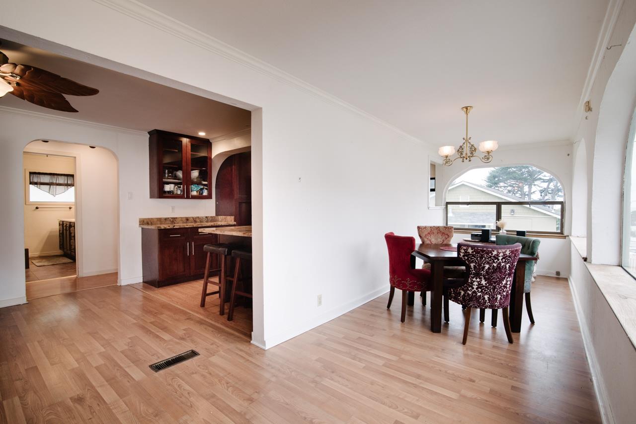 600 Brighton Road Pacifica, CA 94044 - Photo 8 of 45 a view of a dining room with furniture and chandelier