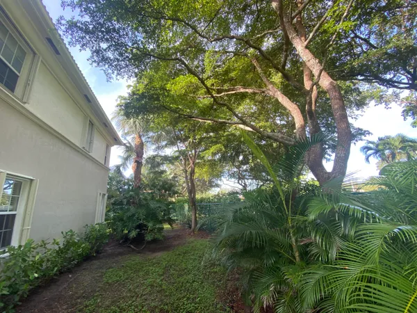 a backyard of a house with lots of green space
