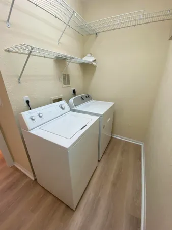 a utility room with dryer and washer