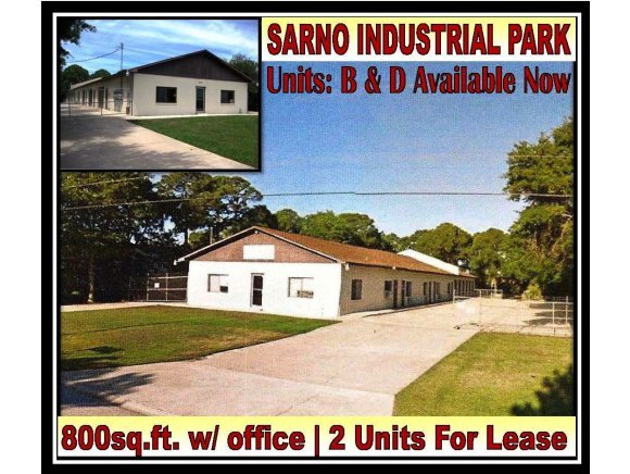 a view of outdoor space with a garden and signage