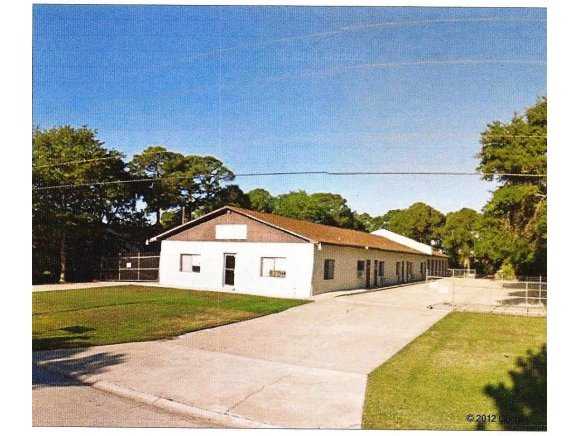 772 Washburn Road, Unit B Melbourne, FL 32934 - Photo 2 of 5 a white house with a large pool in front of it